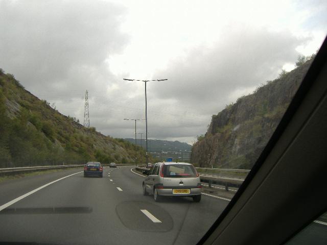 File:The M4 traversing the Earlswood Cutting, part of the 'M4 gap' which was only closed during the mid-1990s. Briton Ferry-Llansawel is now behind the motorway. - Coppermine - 7376.jpg