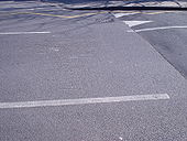 Damage to road at speed hump - Coppermine - 5105.JPG