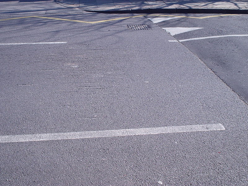File:Damage to road at speed hump - Coppermine - 5105.JPG