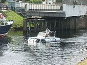 Land Rover passing under the A82 bridge over the Caledonian Canal in Fort Augustus - Coppermine - 6941.jpg