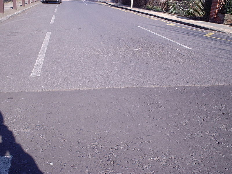 File:Damage to road at speed hump - Coppermine - 5106.JPG