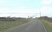 View west along the A4080 towards Glan Morfa and the Anglesey Golf Club Clubhouse - Geograph - 1049157.jpg