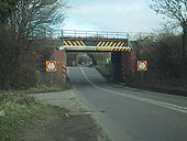 The railway crosses the A429 - Geograph - 1107594.jpg