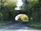Railway bridge for the old Cheltenham to Banbury line crossing the A436 at Hampen hill - Geograph - 1556220.jpg