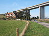 B1456 and house dominated by the western end of the Orwell Bridge - Geograph - 1001968.jpg
