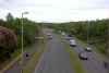 Thamesdown Drive looking west from the footbridge - Geograph - 5392372.jpg