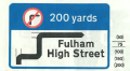 Advance direction sign to show route avoiding prohibition ahead - phased out in 1994