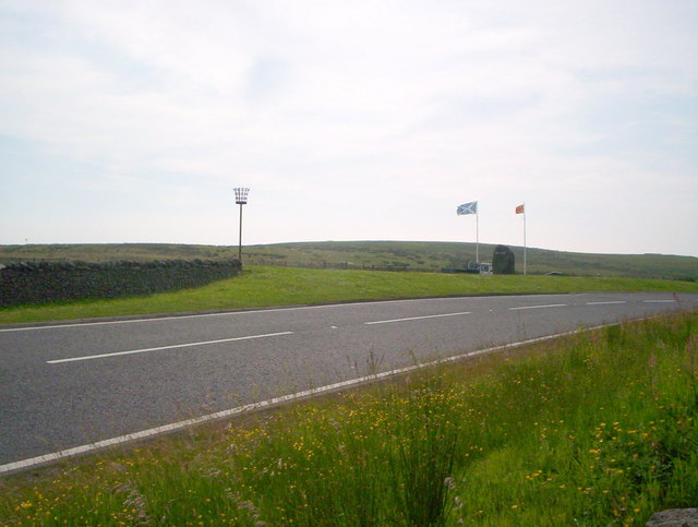 File:The A68 at Carter Bar with border flags, marker stone and beacon - Geograph - 1383678.jpg