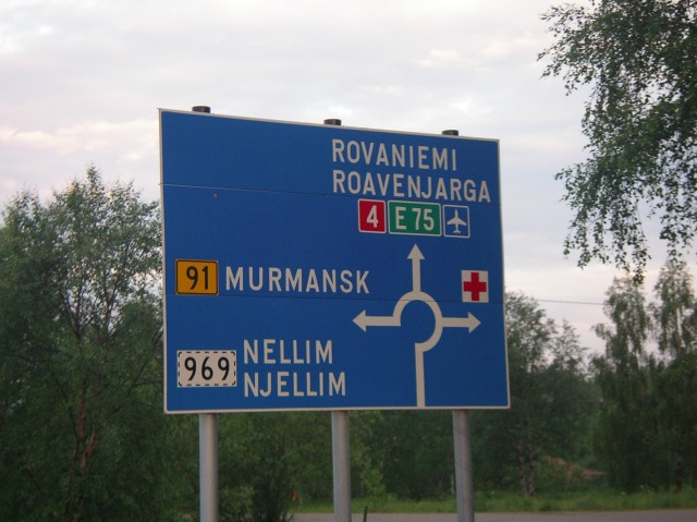 File:Roundabout sign, Ivalo, Finland - Murmansk on Route 91 is just over there - Coppermine - 6738.jpeg