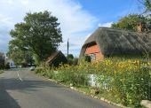 Thatched House with Flowers - Geograph - 4197502.jpg
