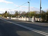 Impressive garden wall beside the A177 road - Geograph - 404894.jpg