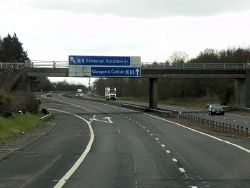 Newline Road Bridge and Direction Signs, M9-M80 Junction - Geograph - 4031863.jpg