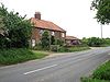 Farm cottages and honesty stall on Holt Road - Geograph - 1319116.jpg