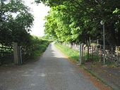 Continuation of the old A5 as a farm road and a public footpath - Geograph - 814572.jpg