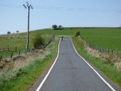 Cyclist on Auchentiber Road - Geograph - 4969579.jpg