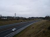 Mobile phone mast and M77 - Geograph - 1770545.jpg