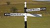 A road sign near Kirkland Bridge - Geograph - 1725933.jpg