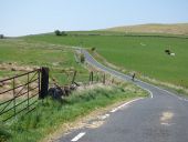 C17 Cyclist on Auchentiber Road - Geograph - 4969574.jpg