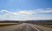 20170930-1827 - I-90 eastbound with Lake DeSmet to the north east 44.5400647N 106.8081783W - cropped.jpg