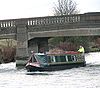Canal boat passing bridge - Geograph - 1618574.jpg